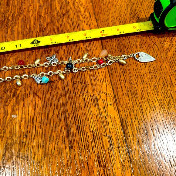 Chico’s 34 in charm necklace tag still attached. Charms include heart, star, etc - Picture 5 of 7